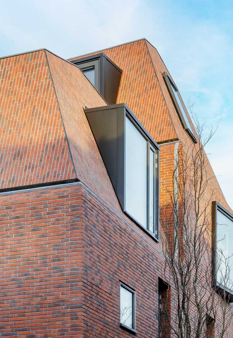 Knauf AQUAPANEL® woning met schuine daken